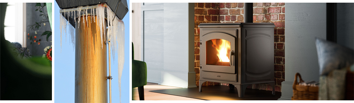 Ambientebild eines Pelletofens in einem leerstehenden Kamin und einem gefrorenem und versottenden Schornstein