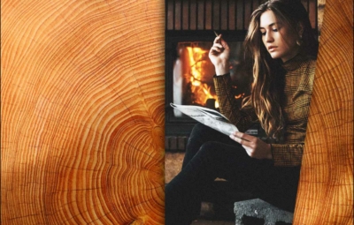 Zeitung lesende Frau vor Kamin